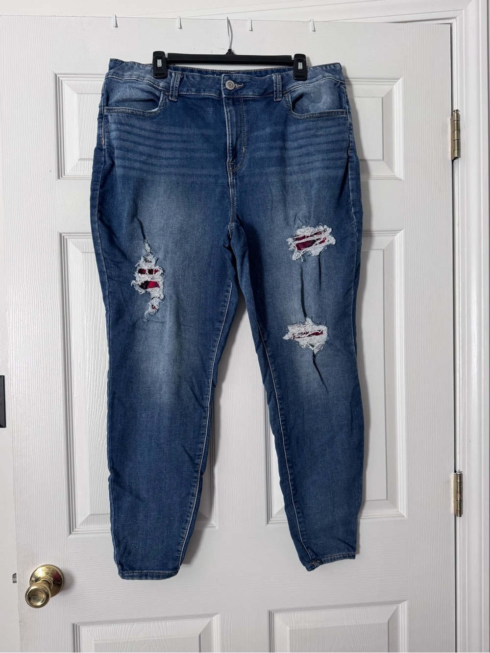 Maurices Blue Distressed Skinny Jeans with Red Plaid Backing